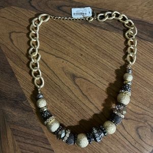 International Concept Jet/Gold single strand necklace